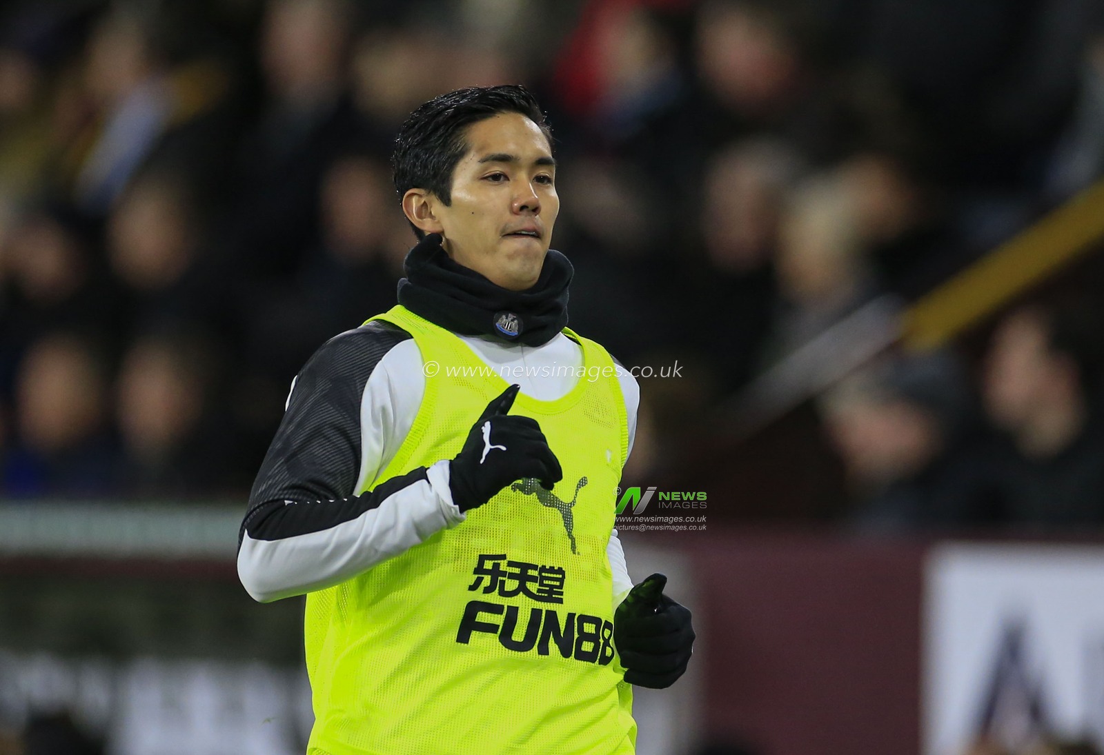 14th December 2019, Turf Moor, Burnley, England; Premier League, Burnley v Newcastle United : Yoshinori Muto (13) of Newcastle United warms up on the sidelines

Credit: Conor Molloy/News Images