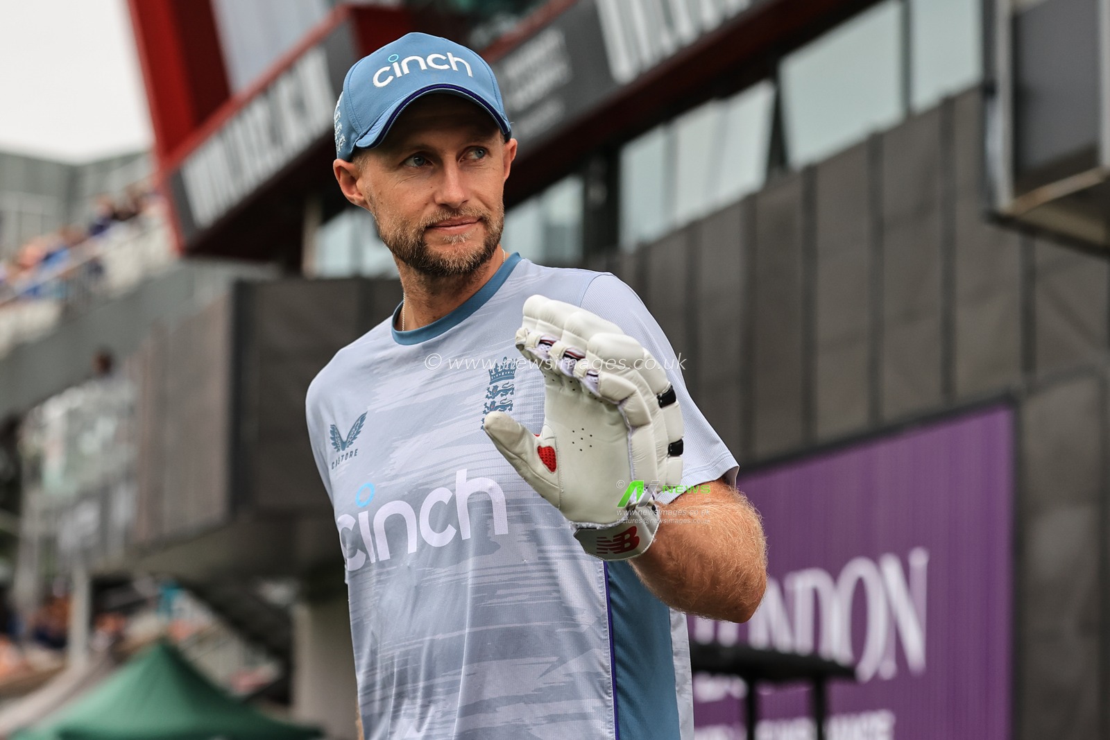 Joe Root of England waves to the fans as he walks out for the warmup session