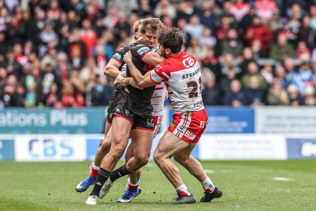 Sam Walters of Wigan Warriors is tackled by Noah Stephens of St Helens during the Betfred Super League round 7 match St Helens vs Wigan Warriors at The BrewDog Stadium, St Helens, United Kingdom on 03 April 2026

(Photo by Alfie Cosgrove/News Images)