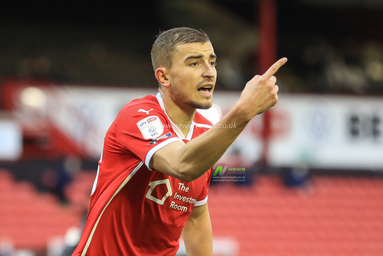 Michal Helik #30 of Barnsley gives his team mates instructions