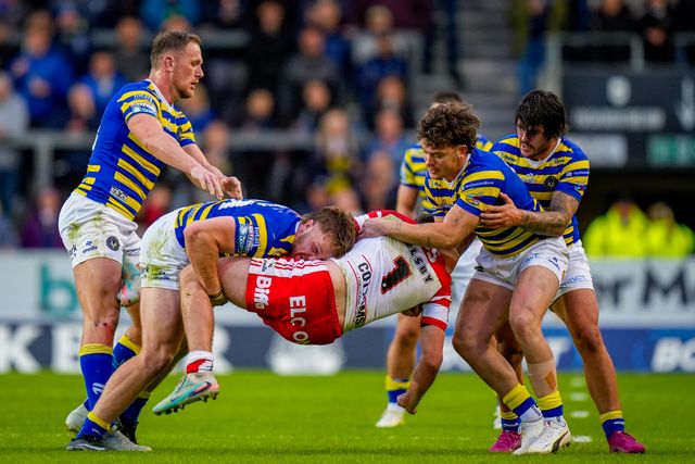 Jack Welsby of St Helens R.F.C. is tackled by a group of Warrington players during the Betfred Super League round 14 match St Helens vs Warrington Wolves at The BrewDog Stadium, St Helens, United Kingdom on 11 June 2026

(Photo by Maynard Manyowa/News Images)