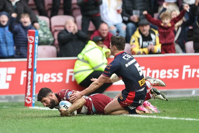 Abbas Miski of Wigan Warriors goes over for a try to make it 22-14 during the Betfred Super League Round 8 match Wigan Warriors vs St Helens at The Brick Community Stadium, Wigan, United Kingdom, 18th April 2025

(Photo by Mark Cosgrove/News Images)