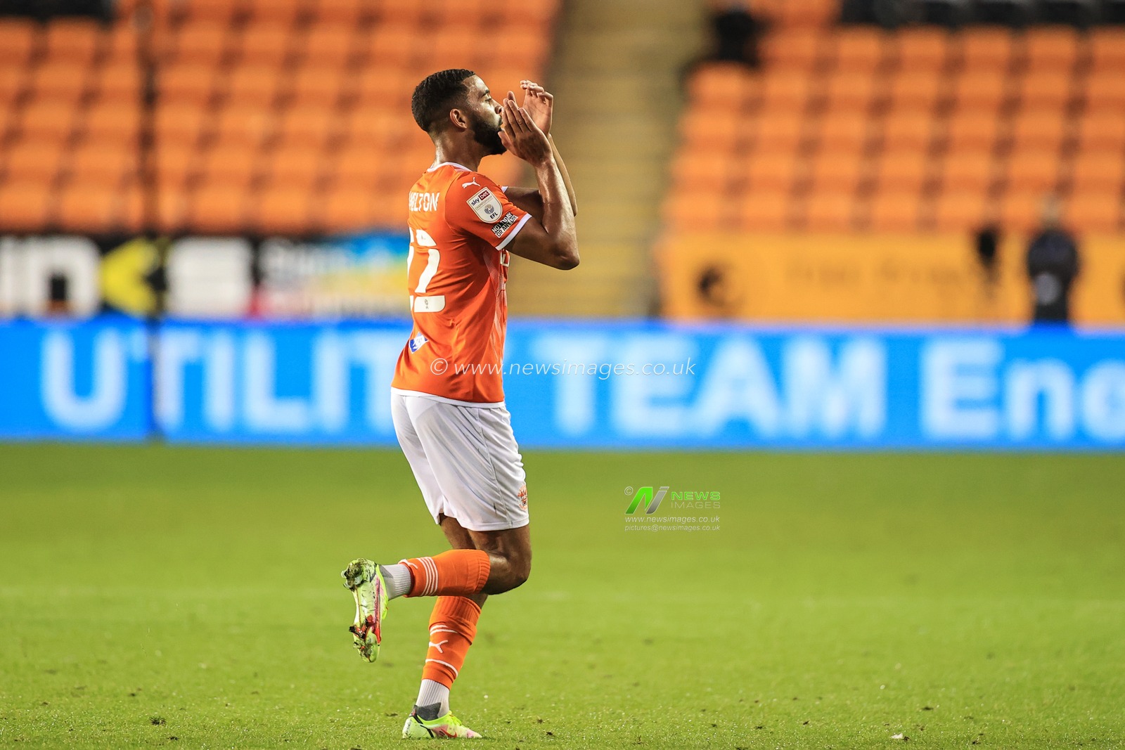 Cj Hamilton #22 of Blackpool apoulds the fans as heâ€™s substituted