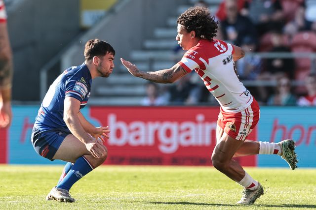 Tristan Sailor of St Helens R.F.C. is tackled by Jack Sinfield of Wakefield Trinity during the Betfred Super League round 9 match St Helens vs Wakefield Trinity at The BrewDog Stadium, St Helens, United Kingdom on 25 April 2026

(Photo by Mark Cosgrove/News Images)