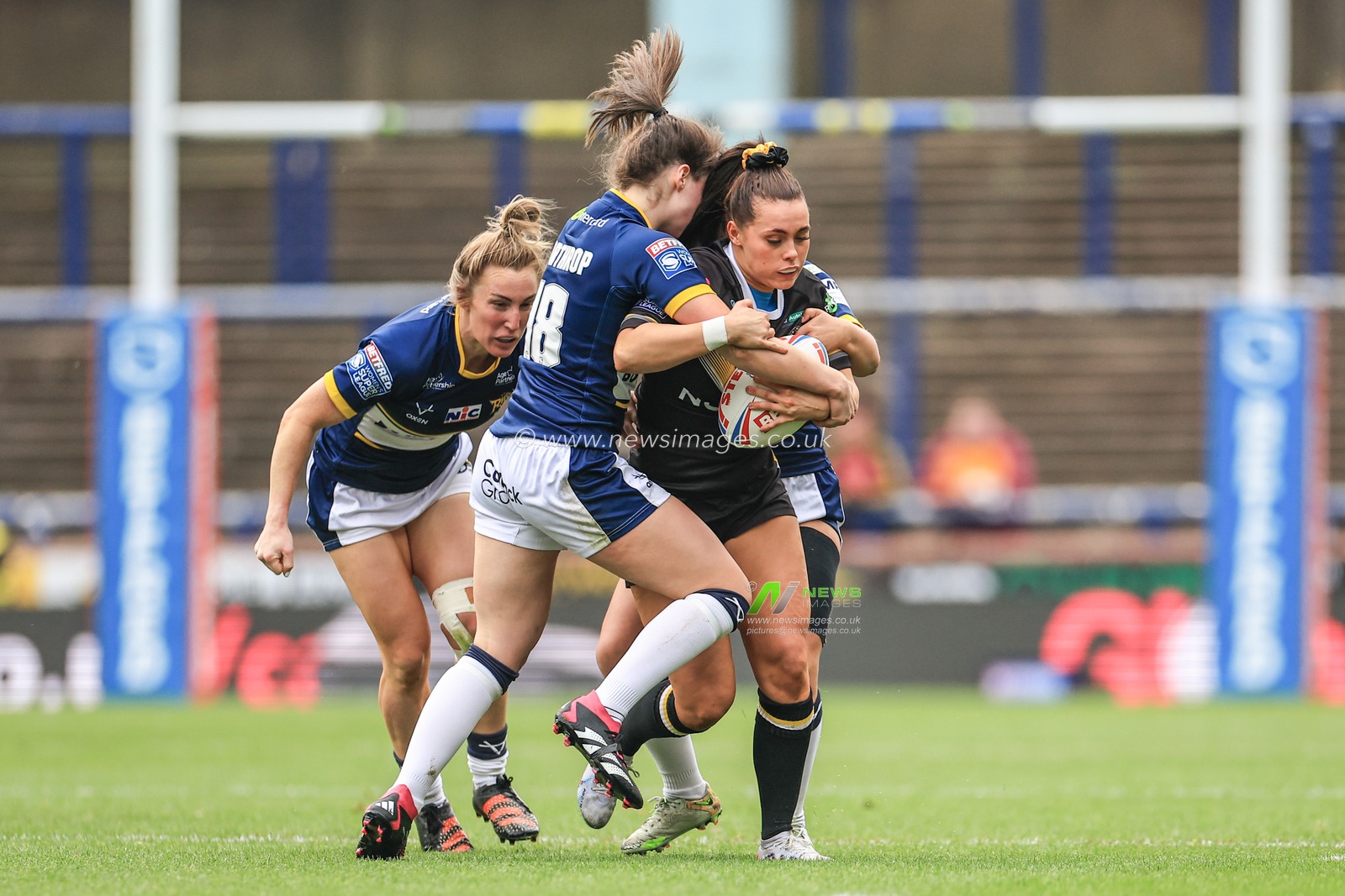 Lacey Owen of York Valkyrie is tackled by Izzy Northrop of Leeds Rhinos during the Betfred Women's Super League match Leeds Rhinos vs York Valkyrie at Headingley Stadium, Leeds, United Kingdom, 9th April 2023

(Photo by Mark Cosgrove/News Images)