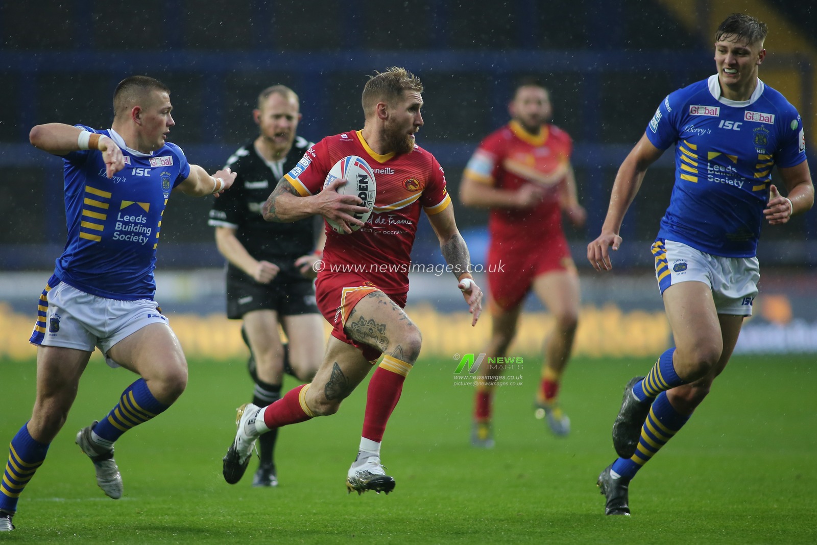 Sam Tomkins of Catalan Dragons on the attack against Leeds Rhinos.