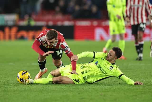 Jordan Williams of Portsmouth slide tackles Harrison Burrows of Sheffield United during the Sky Bet Championship match Sheffield United vs Portsmouth at Bramall Lane, Sheffield, United Kingdom, 26th November 2025

(Photo by Mark Cosgrove/News Images)

*** GER AUT SUI OUT ***