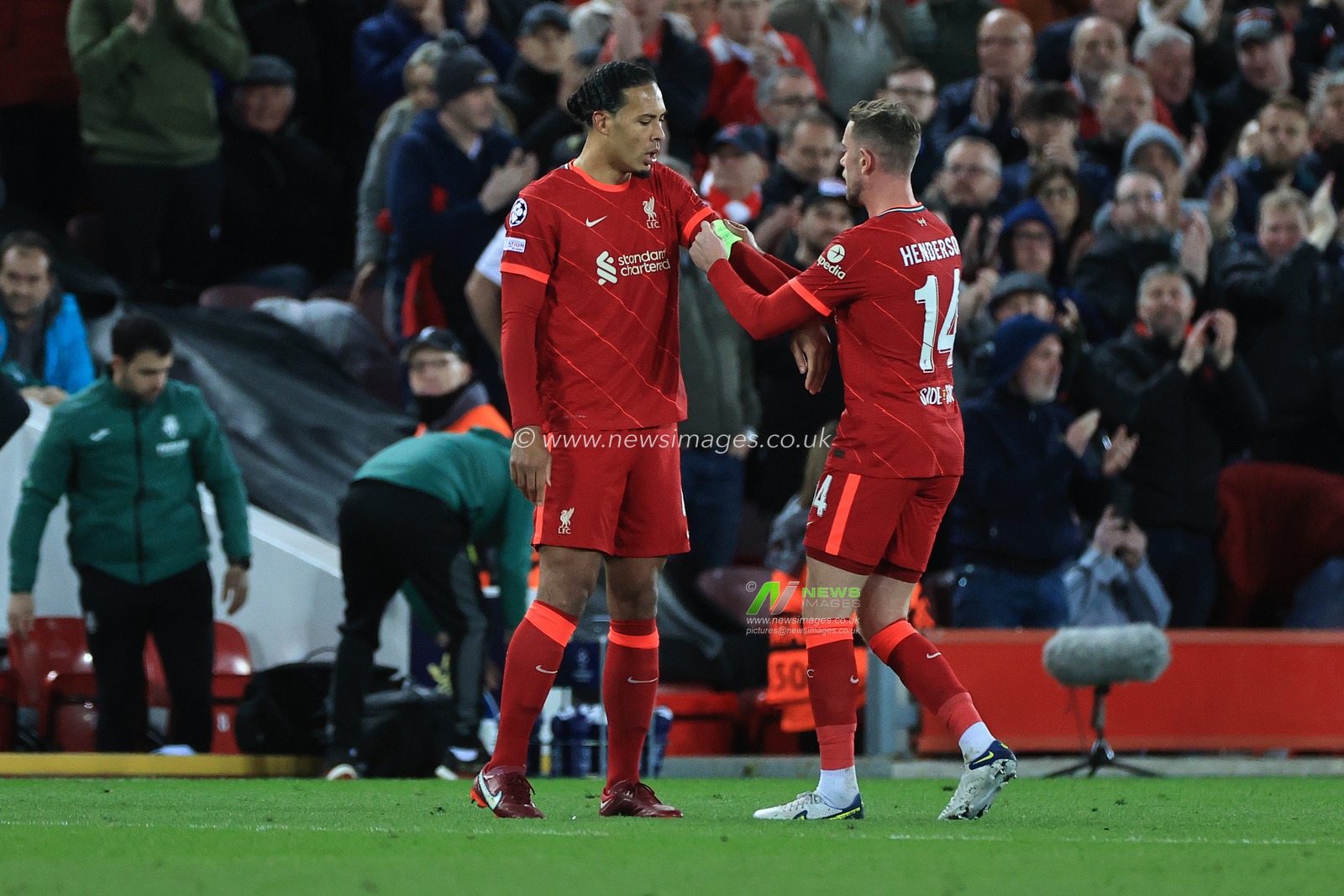 Jordan Henderson #14 of Liverpool gives the arm band to Virgil van Dijk #4 of Liverpool