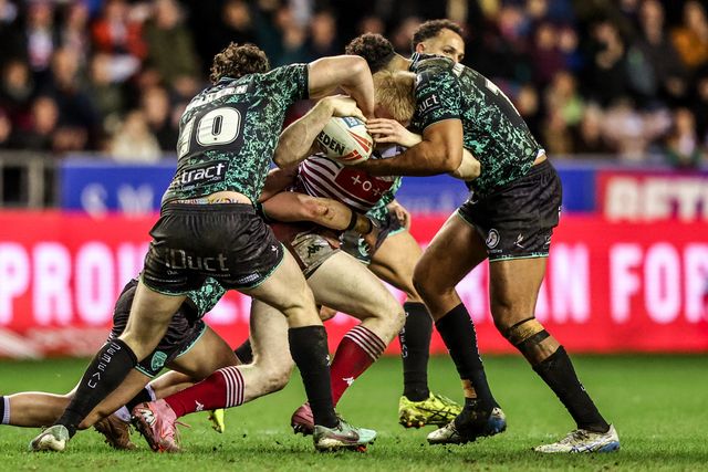 Zach Eckersley of Wigan Warriors is tackled by Robbie Mulhern of Leigh Leopards during the Betfred Super League match Wigan Warriors vs Leigh Leopards at The Brick Community Stadium, Wigan, United Kingdom on 26 February 2026

(Photo by Alfie Cosgrove/News Images)