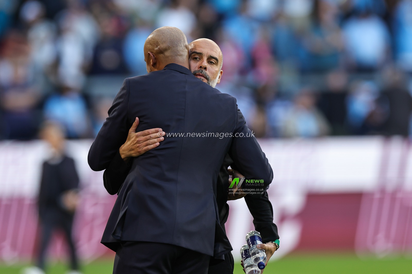 Vincent Kompany Manager of Burnley and Pep Guardiola head coach of Manchester City embrace ahead of the Premier League match Burnley vs Manchester City at Turf Moor, Burnley, United Kingdom, 11th August 2023

(Photo by Mark Cosgrove/News Images)