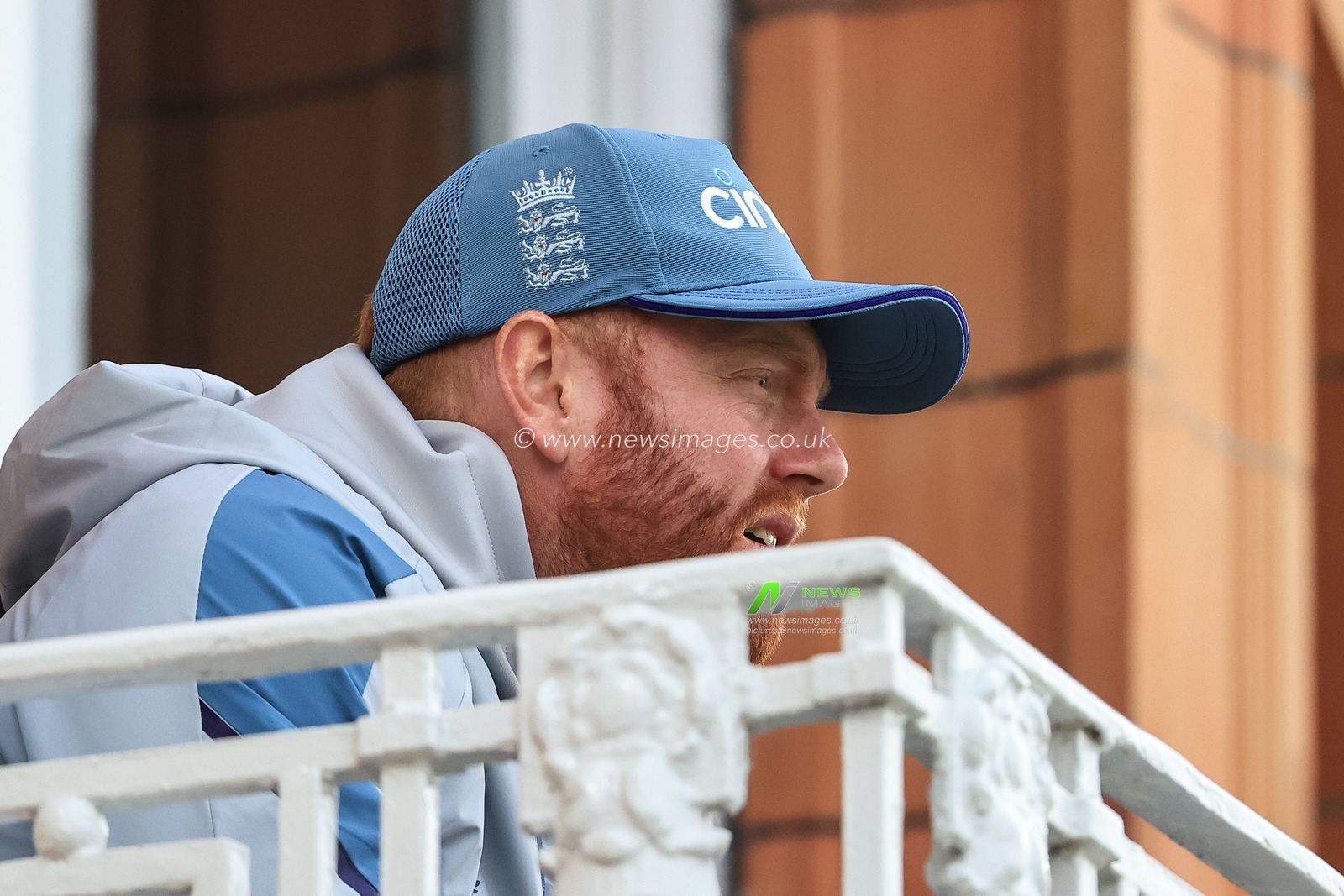 Jonny Bairstow of England watches on from the pavilion balcony as England need 73 runs to win