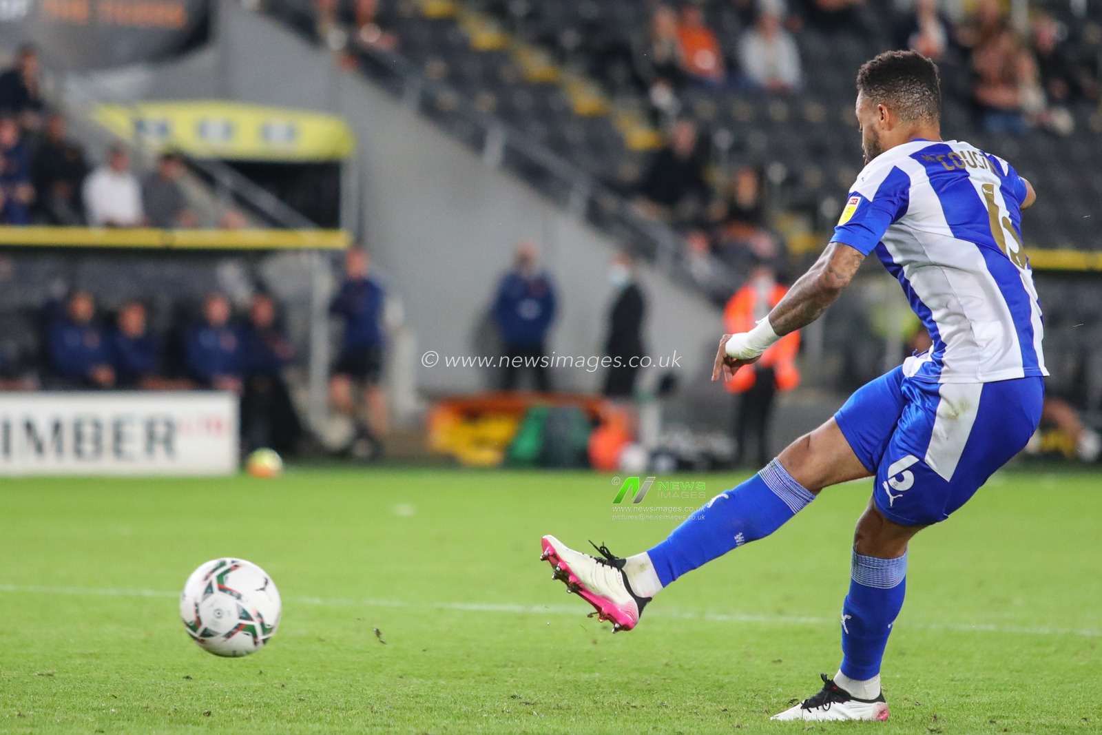 Jordan Cousins #6 of Wigan Athletic scores they winning penalty