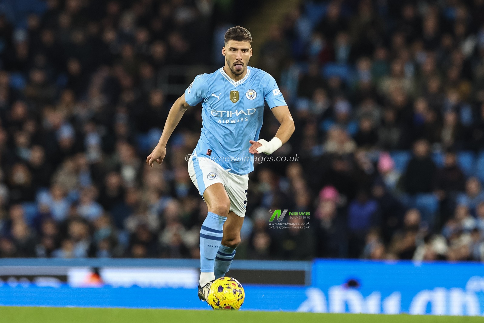 RÃºben Dias of Manchester City breaks with the ball during the Premier League match Manchester City vs Brentford at Etihad Stadium, Manchester, United Kingdom, 20th February 2024

(Photo by Mark Cosgrove/News Images)