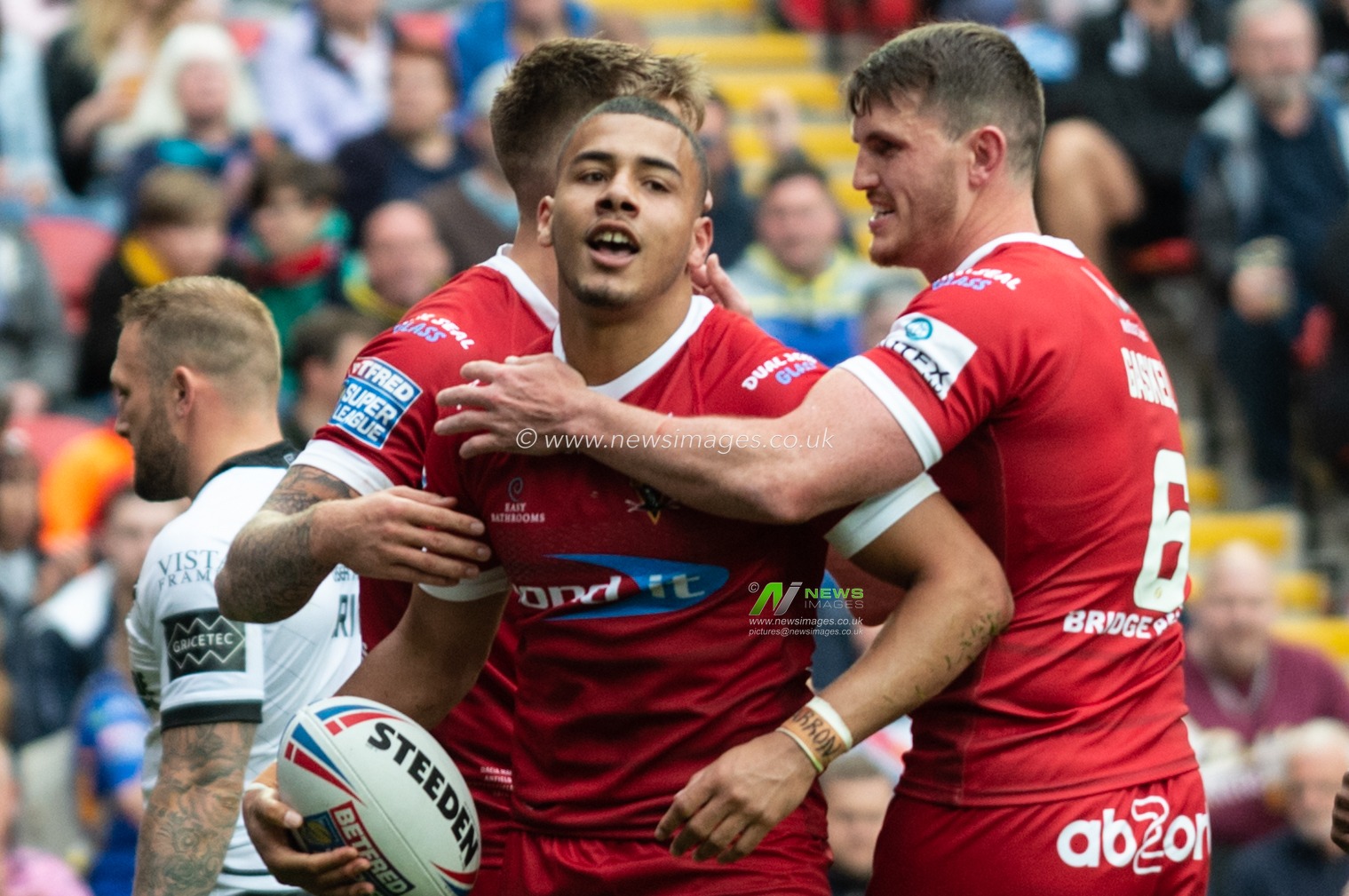25th May 2019 , Anfield Stadium, Liverpool, England; Dacia Magic Weekend, Betfred Super League Round 16, Hull FC vs Huddersfield Giants ; Darnell Mcintosh (1) of Huddersfield Giants celebrates his try

Credit: Richard Long/News Images