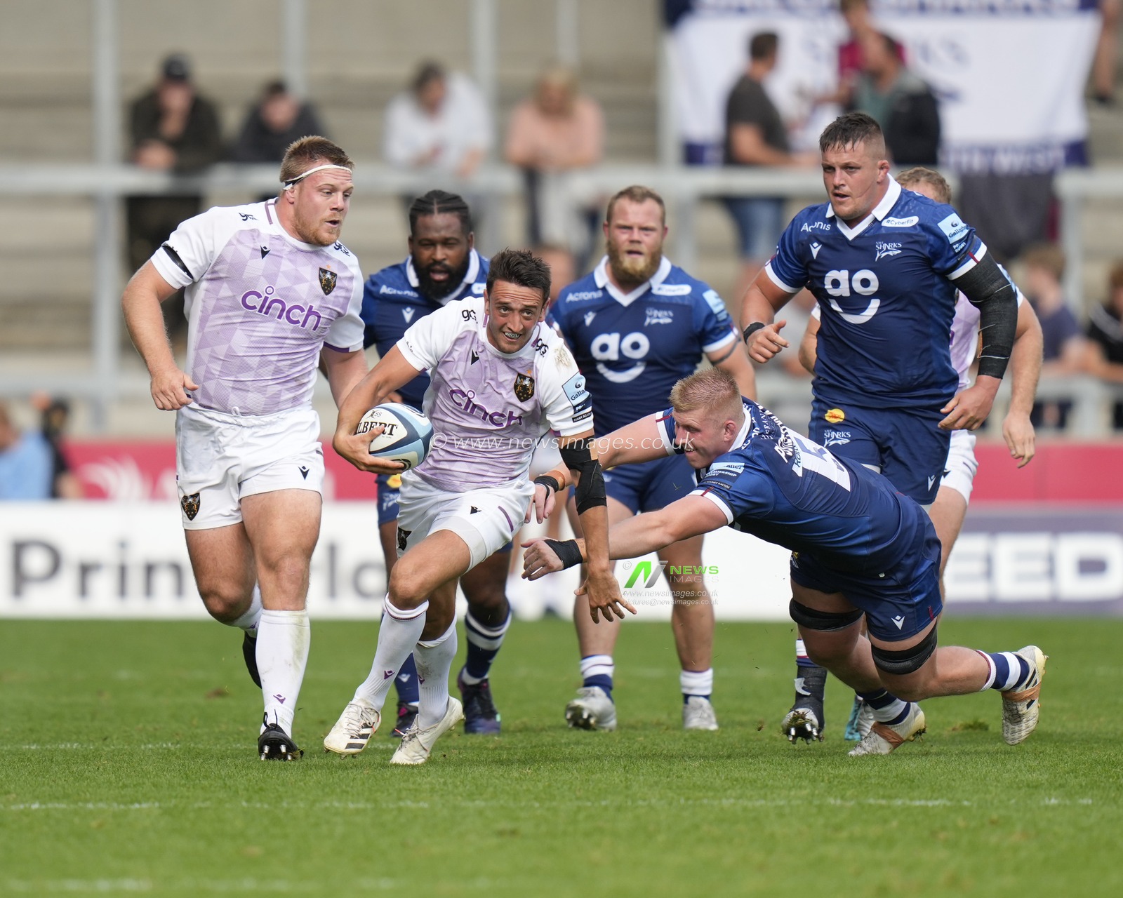 Northampton Saints Alex Mitchell makes a break past Sale Sharks Matt Postlethwaite during the Gallagher Premiership match Sale Sharks vs Northampton Saints at AJ Bell Stadium, Eccles, United Kingdom, 11th September 2022

(Photo by Steve Flynn/News Images)