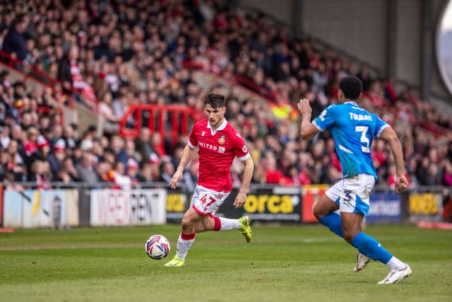 Wrexham's Ryan Longman takes on Stockport County's Ibou Touray during the Sky Bet League 1 match Wrexham vs Stockport County at SToK Cae Ras, Wrexham, United Kingdom, 22nd March 2025

(Photo by Nik Mesney/News Images)