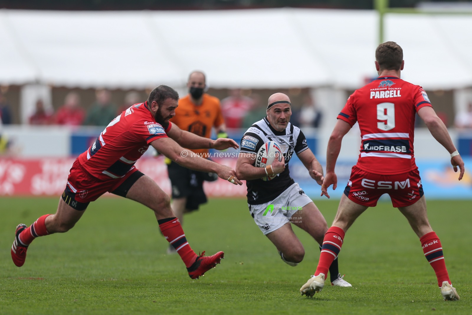 Danny Houghton #9 of Hull FC runs at the Hull KR defence