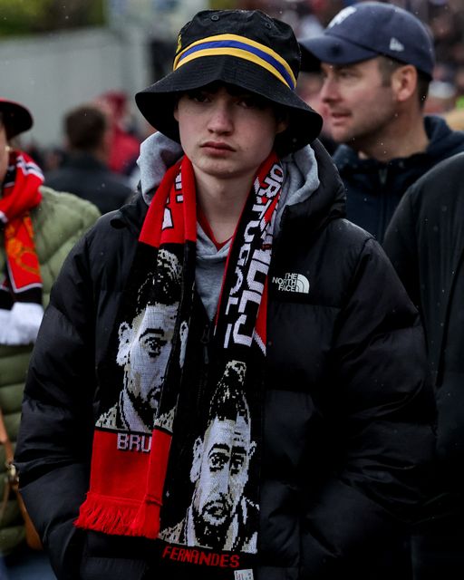 A Manchester United fan wearing a Bruno Fernandes of Manchester United scarf during the Premier League match Manchester United vs Leeds United at Old Trafford, Manchester, United Kingdom on 13 April 2026

(Photo by Mark Cosgrove/News Images)