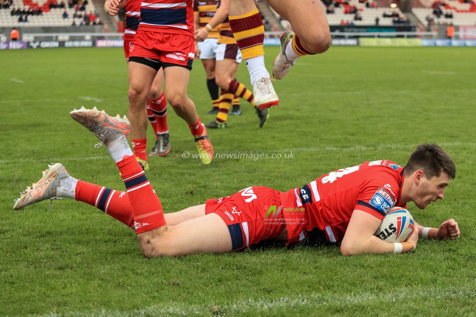Sam Wood (24) of Hull KR goes over for a try in the first half