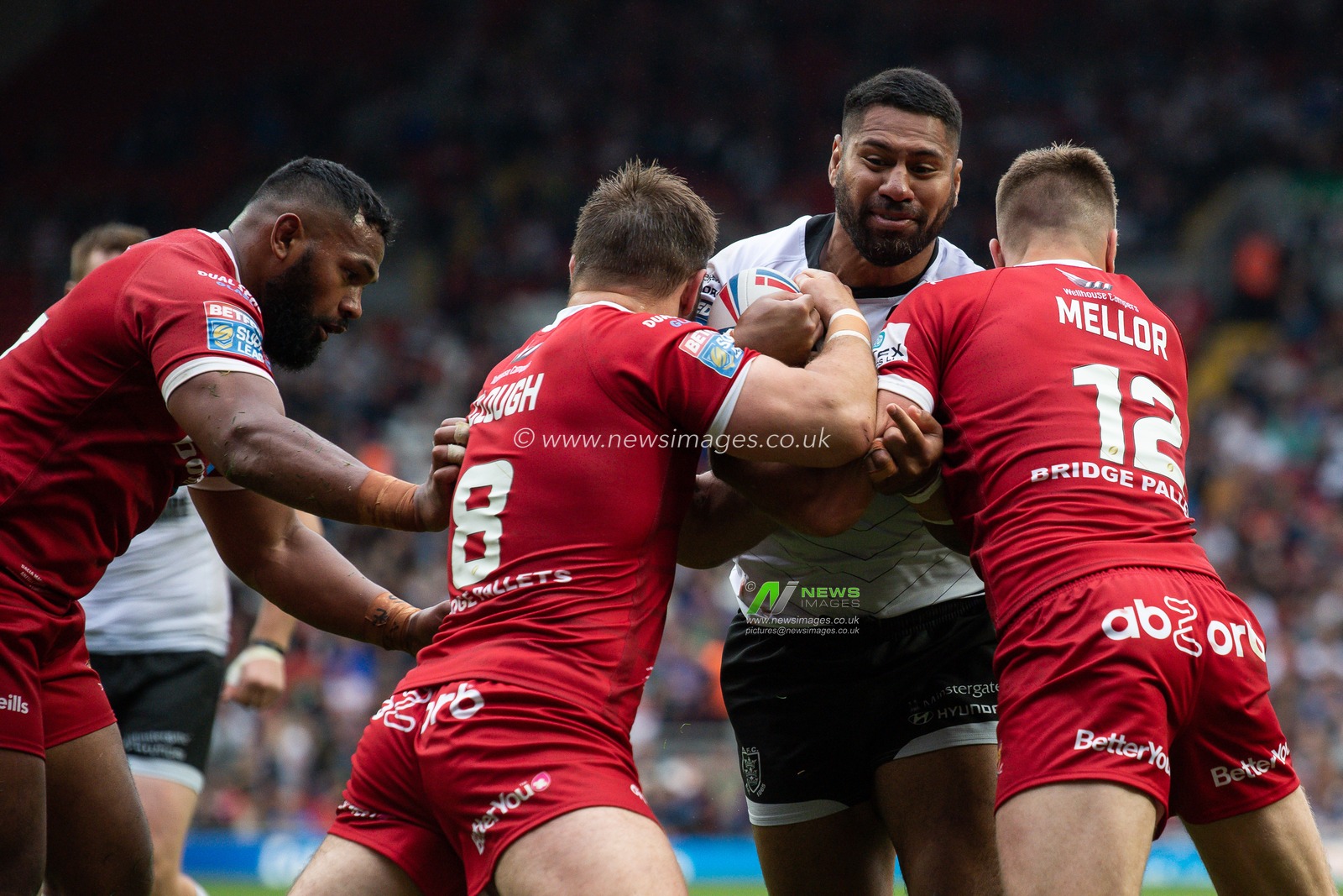 25th May 2019 , Anfield Stadium, Liverpool, England; Dacia Magic Weekend, Betfred Super League Round 16, Hull FC vs Huddersfield Giants ; Mickey Paea (23) of Hull FC is tackled by Paul Clough (8) of Huddersfield Giants 

Credit: Craig Thomas/News Images