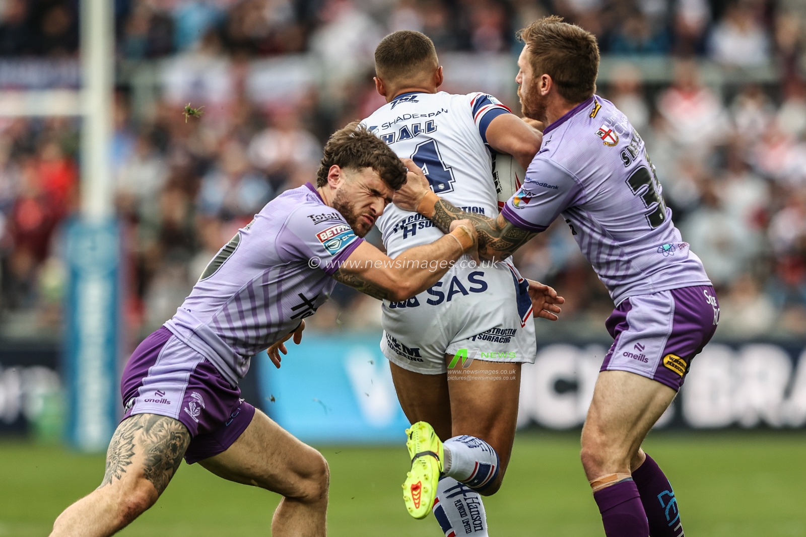 Corey Hall of Wakefield Trinity is tackled by Connor Wrench of Warrington Wolves and Marc Sneyd of Warrington Wolves during the Betfred Super League Round 11 match Wakefield Trinity vs Warrington Wolves at DIY Kitchens Stadium, Wakefield, United Kingdom, 18th May 2025

(Photo by Alfie Cosgrove/News Images)