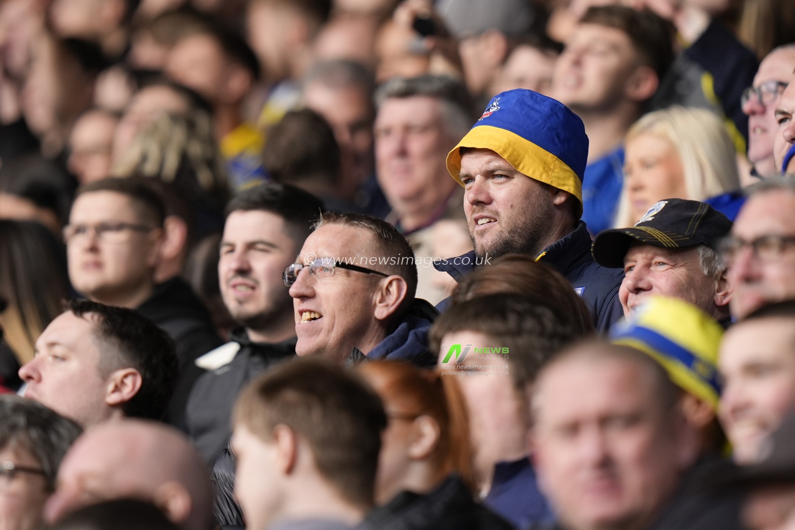 A Warrington Wolves fan watches on during the Betfred Challenge Cup Quarter Final match St Helens vs Warrington Wolves at Totally Wicked Stadium, St Helens, United Kingdom, 14th April 2024

(Photo by Steve Flynn/News Images)