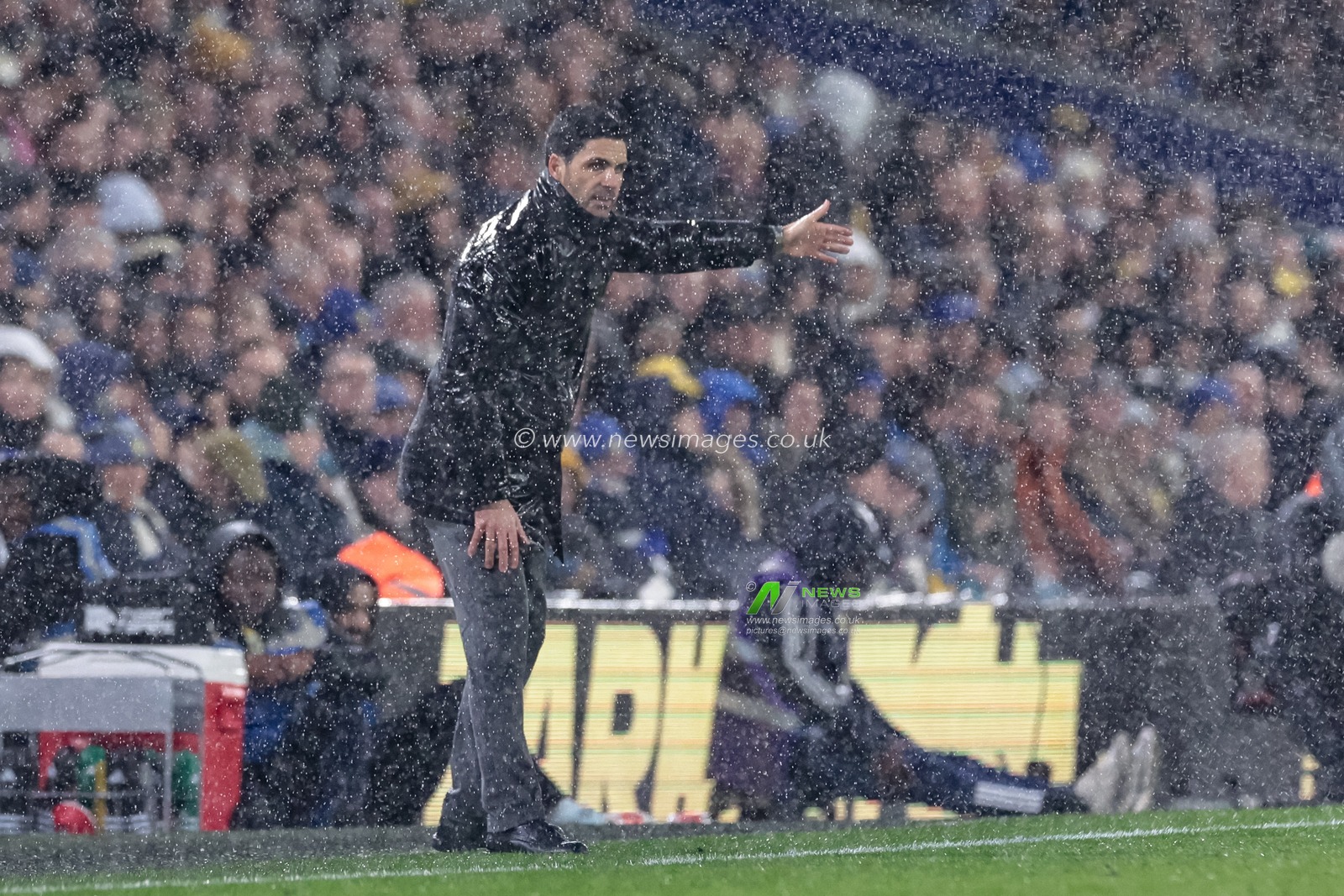 Mikel Arteta manager of Arsenal reacts in the technical area as therein pours during the Premier League match Leeds United vs Arsenal at Elland Road, Leeds, United Kingdom, 31st January 2026

(Photo by Mark Cosgrove/News Images)