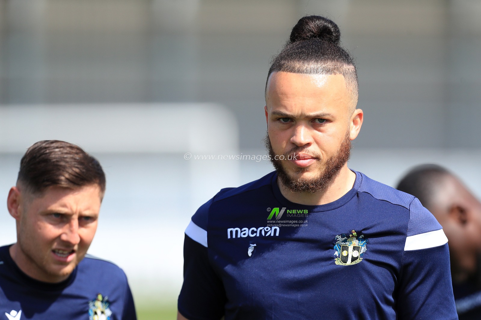 Louis John #6 of Sutton United seen warming up prior to kick off.