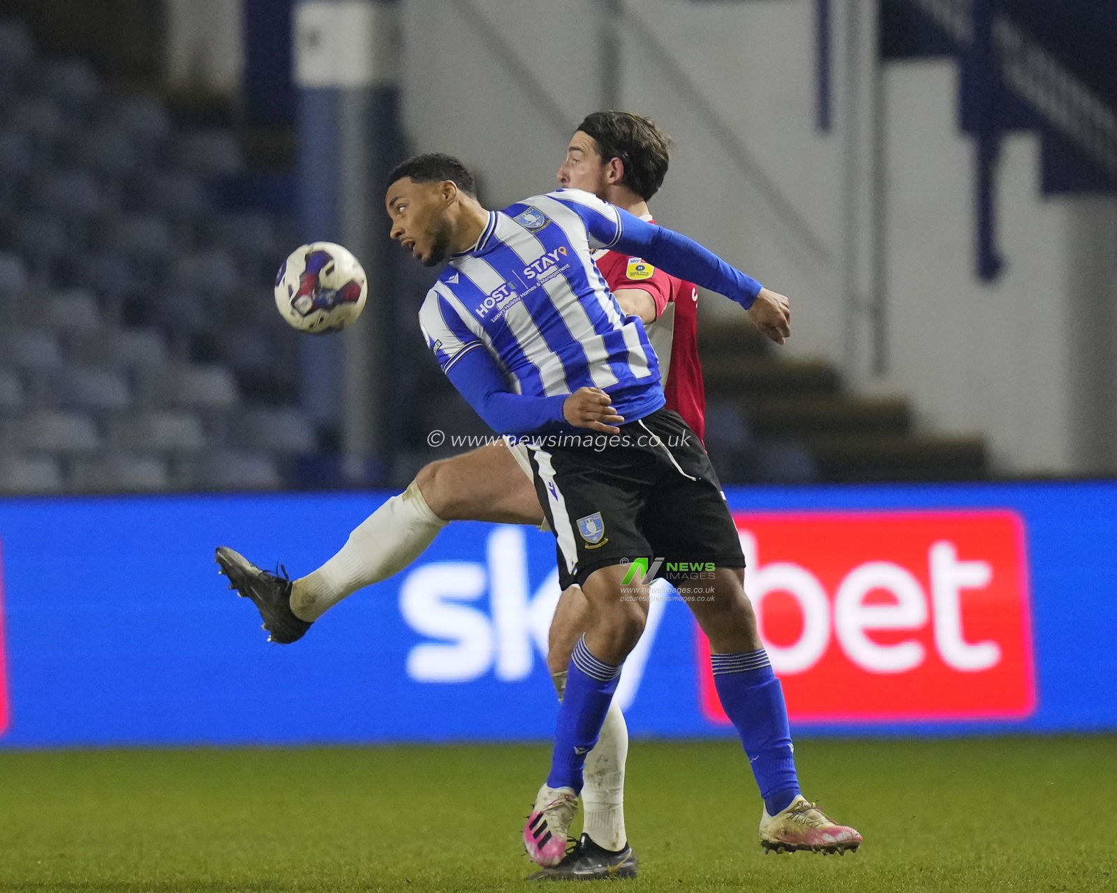 Akin Famewo #15 of Sheffield Wednesday competes for a header with Cole Stockton #9 of Morecambe during the Sky Bet League 1 match Sheffield Wednesday vs Morecambe at Hillsborough, Sheffield, United Kingdom, 14th February 2023

(Photo by Steve Flynn/News Images)