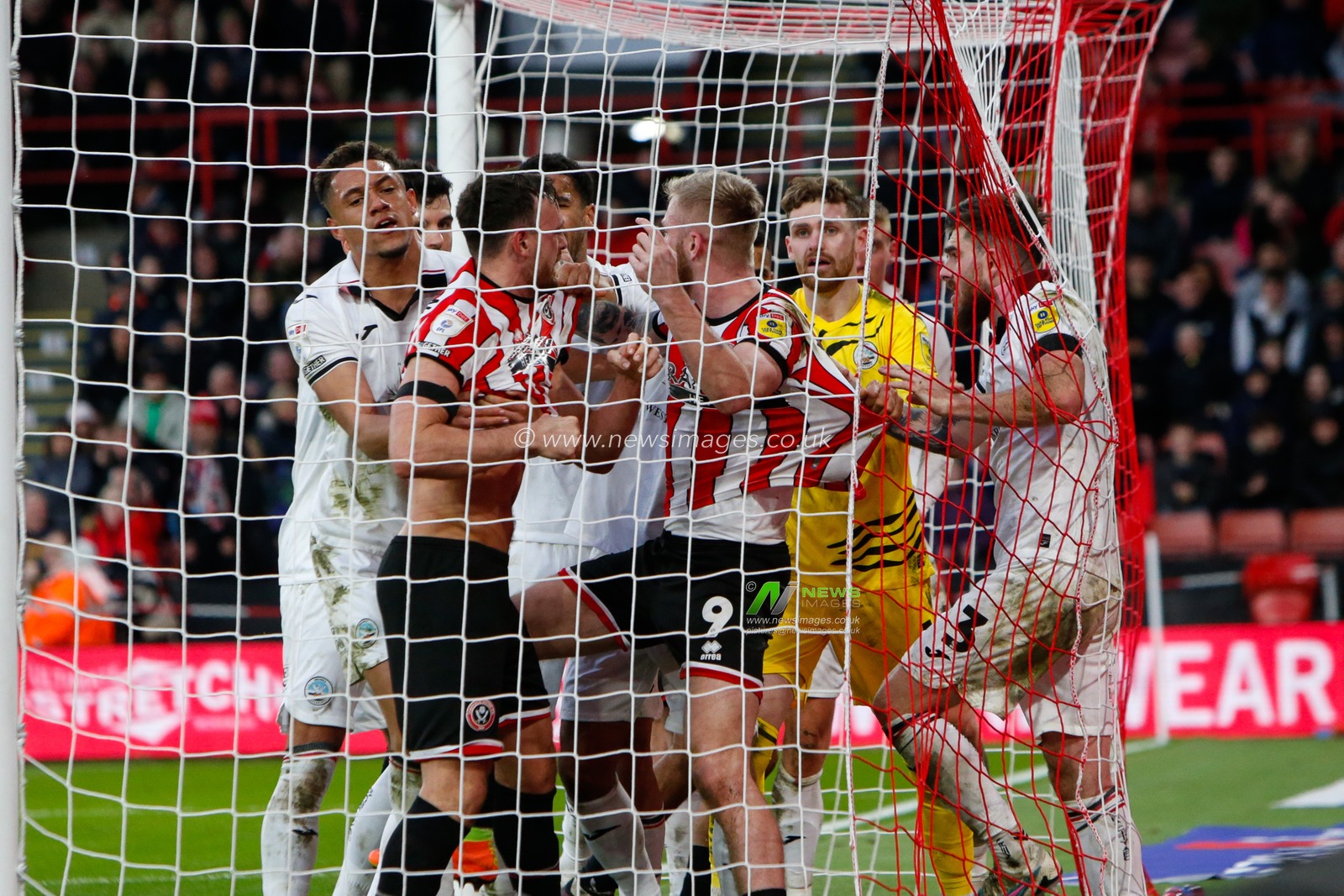Players of Sheffield Wednesday and Swansea City clash during the Sky Bet Championship match Sheffield United vs Swansea City at Bramall Lane, Sheffield, United Kingdom, 11th February 2023

(Photo by Ben Early/News Images)