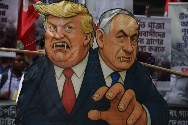 Activists of Social Unity Center of India (SUCI) hold placards and an effigy of US President Donald Trump and Israel's Prime Minister Benjamin Netanyahu during a protest against Western policy in the Israel-Hamas conflict, near US Embassy in Kolkata, Eastern India, 07 October 2025.Photo by Debajyoti Chakraborty.(Photo: Debajyoti Chakraborty/News Images)