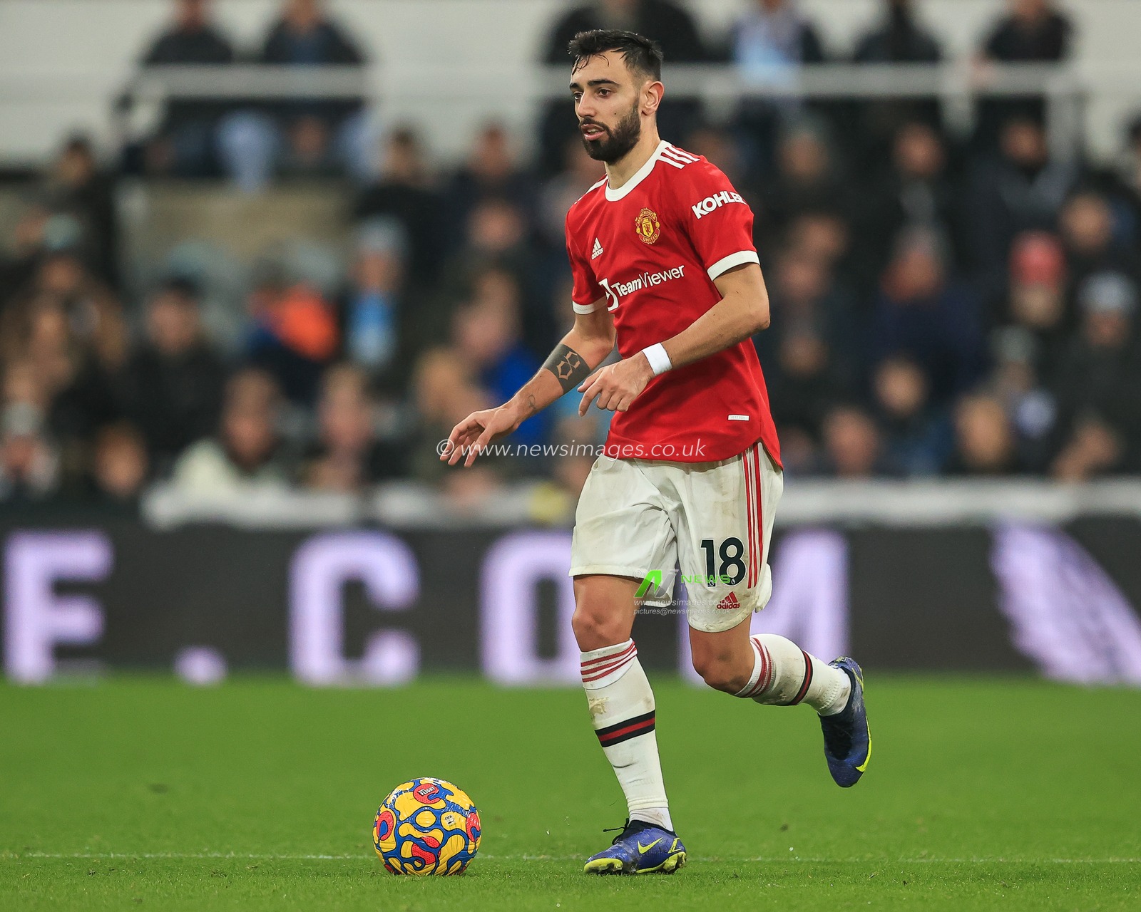 Bruno Fernandes #18 of Manchester United makes a break with the ball
