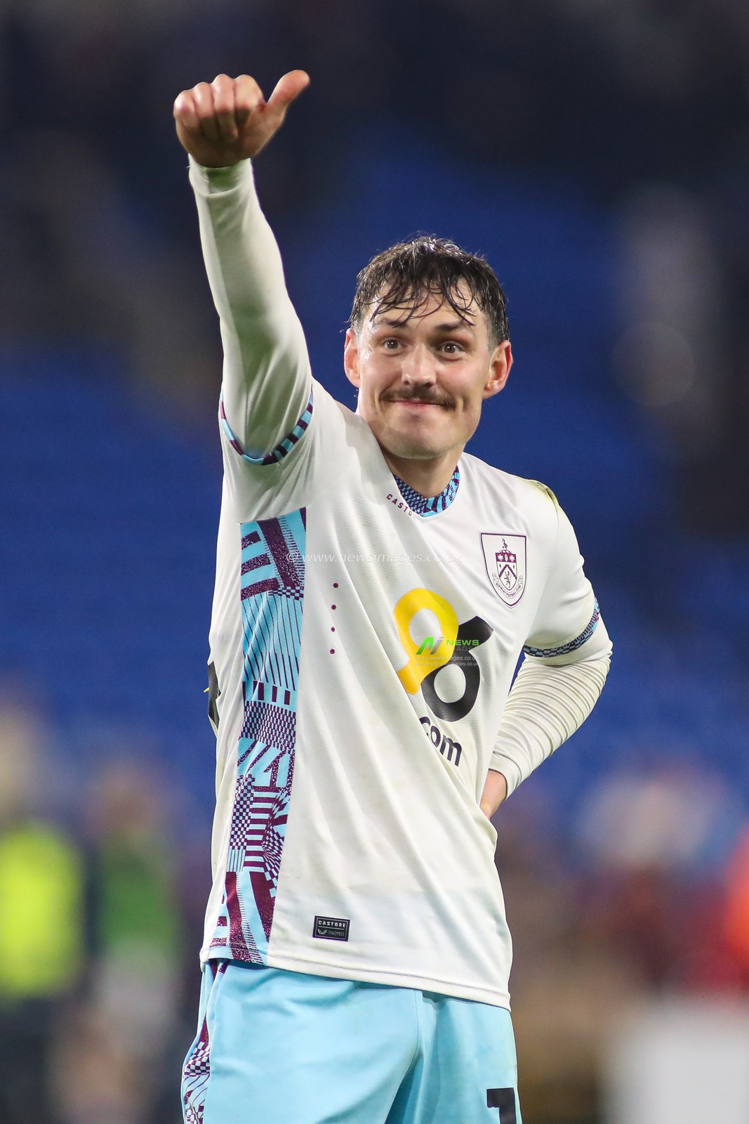Connor Roberts of Burnley celebrates with the Burnley fans at the final whistle during the Sky Bet Championship match Cardiff City vs Burnley at Cardiff City Stadium, Cardiff, United Kingdom, 4th March 2025

(Photo by Andrew Lewis/News Images)