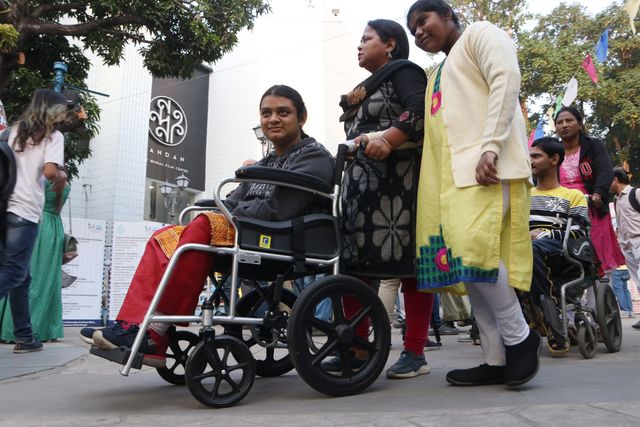 Physically challenge film lovers on a handicapped tricycle to visit a venue of the 30th Kolkata International Film Festival in Kolkata, India, on December 7, 2024.Pictures by Debajyoti Chakraborty.(Photo: Debajyoti Chakraborty/News Images)