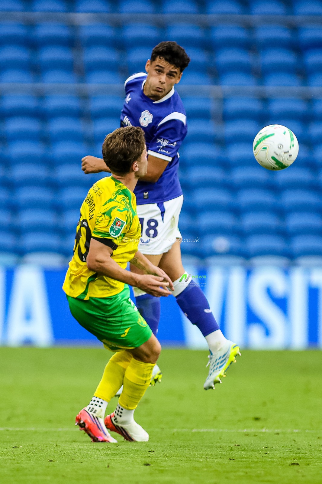 Alex Robertson of Cardiff City heads the ball during the Carabao Cup round 2 match Cardiff City vs Norwich City at Cardiff City Stadium, Cardiff, United Kingdom on 25 August 2026

(Photo by Andrew Lewis/News Images)