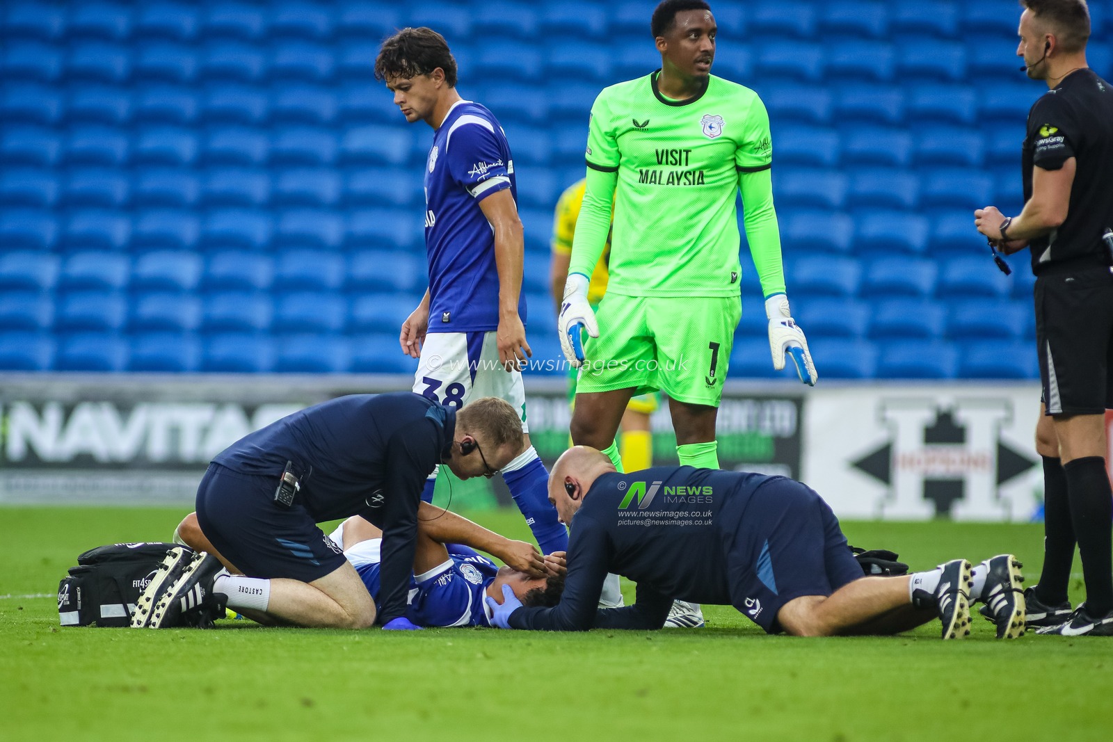 Alex Robertson of Cardiff City receives treatment during the Carabao Cup round 2 match Cardiff City vs Norwich City at Cardiff City Stadium, Cardiff, United Kingdom on 25 August 2026

(Photo by Andrew Lewis/News Images)