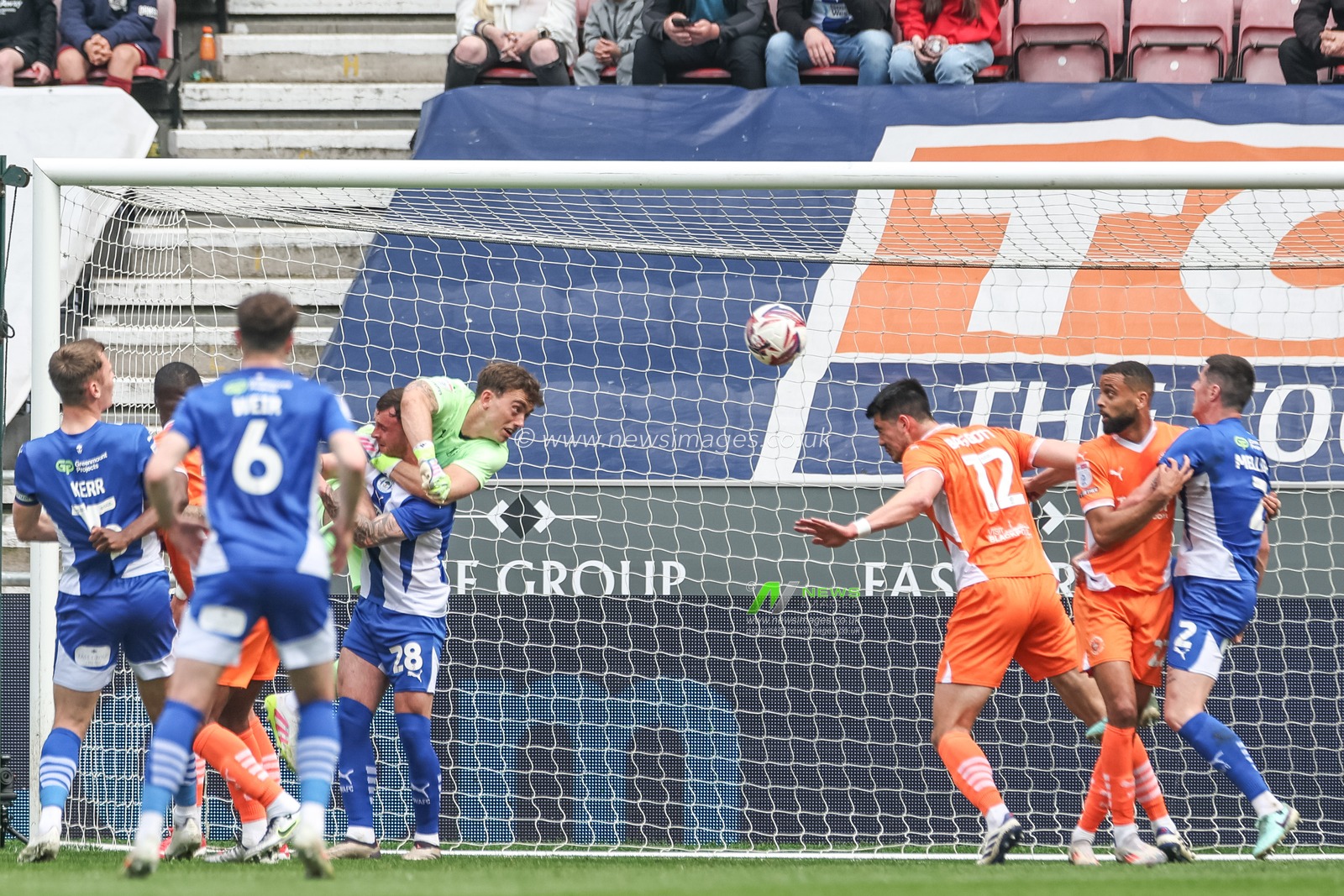 Elkan Baggott of Blackpool heads the ball clear of his defensive area during the Sky Bet League 1 match Wigan Athletic vs Blackpool at The Brick Community Stadium, Wigan, United Kingdom, 26th April 2025

(Photo by Mark Cosgrove/News Images)