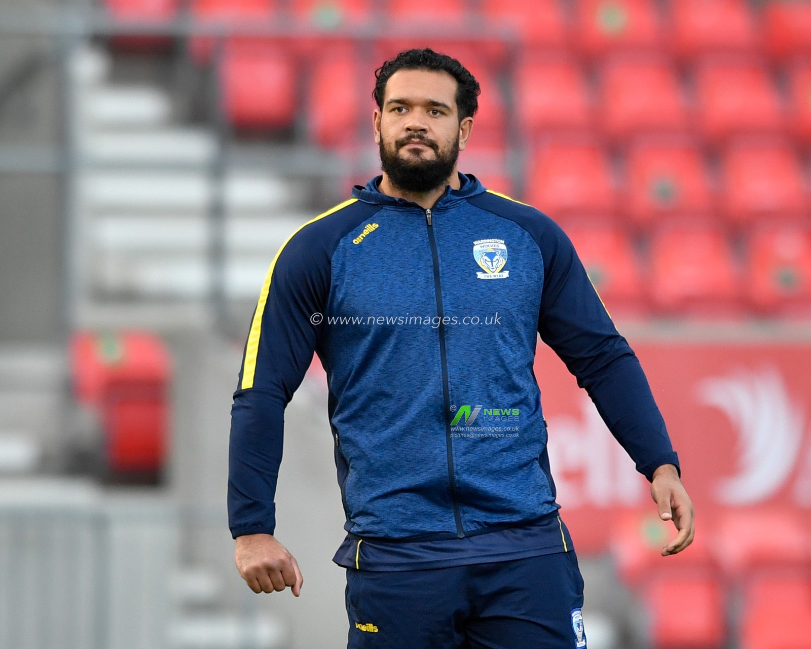 Ben Murdoch-Masila (13) of Warrington Wolves assists with the warm up tonight