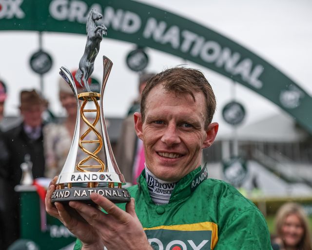 Paul Townend lifts the winner trophy as he wins the 16:00 Randox Grand National Handicap Chase on I Am Maximus during the Randox Grand National Day 2024 at Aintree Racecourse, Liverpool, United Kingdom, 13th April 2024

(Photo by Mark Cosgrove/News Images)