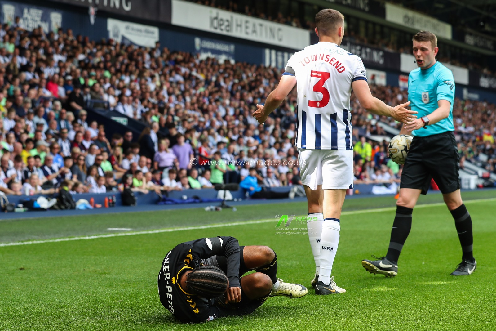 Kyle Walker-Peters of Southampton goes down injured after a tackle from Conor Townsend of West Bromwich Albion during the Sky Bet Championship Play-Off Semi-Final First Leg match West Bromwich Albion vs Southampton at The Hawthorns, West Bromwich, United Kingdom, 12th May 2024

(Photo by Gareth Evans/News Images)