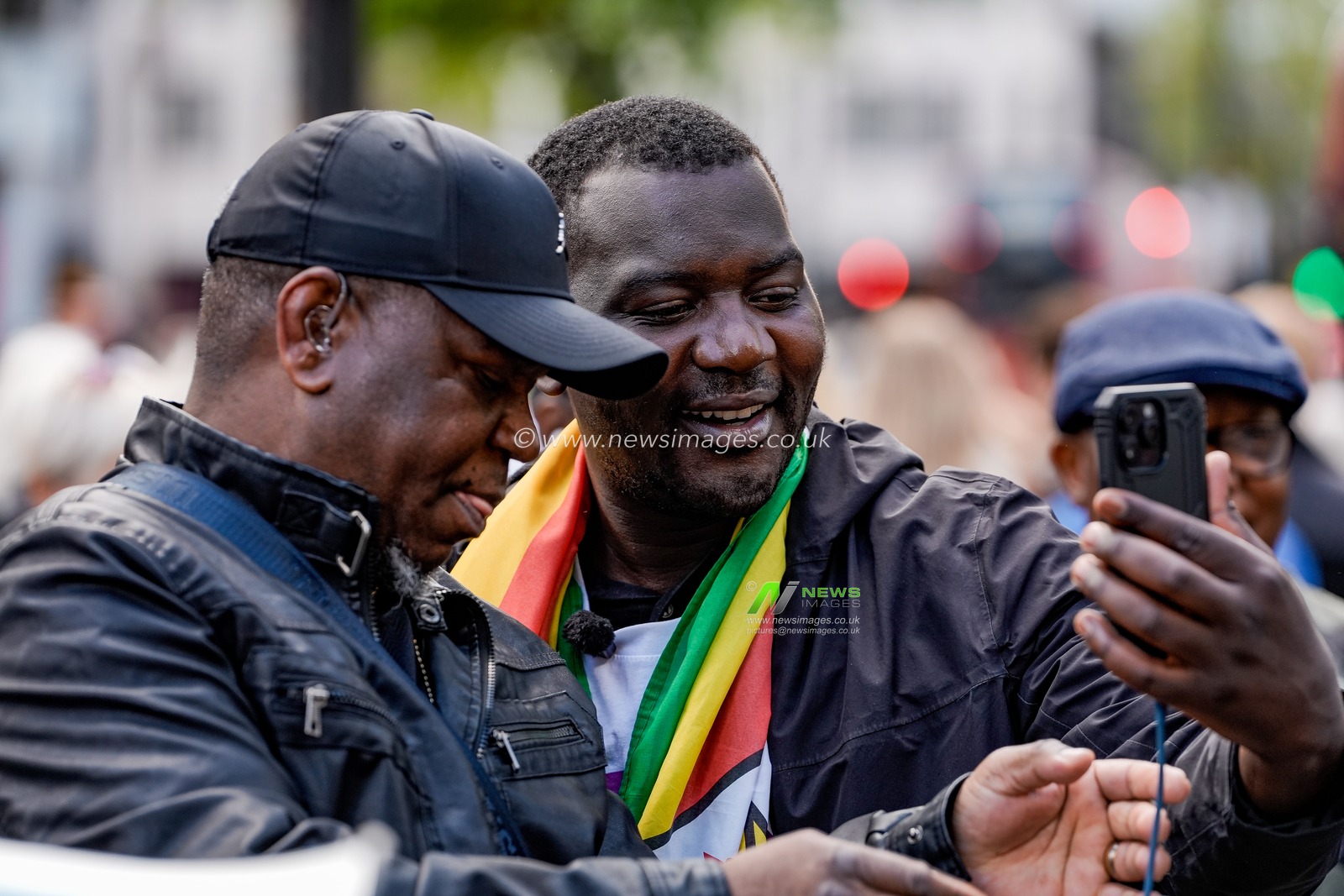 Shepherd Yuda and Makomborero Haruzvishe speak UK-based Zimbabweans gather outside the Zimbabwe Embassy in London on 18 April 2026 to protest the Constitution of Zimbabwe Amendment (No. 3) Bill, which critics say would extend President Mnangagwa’s rule until 2030 and strip citizens of the direct vote for president.

(Photo by Maynard Manyowa/News Images)