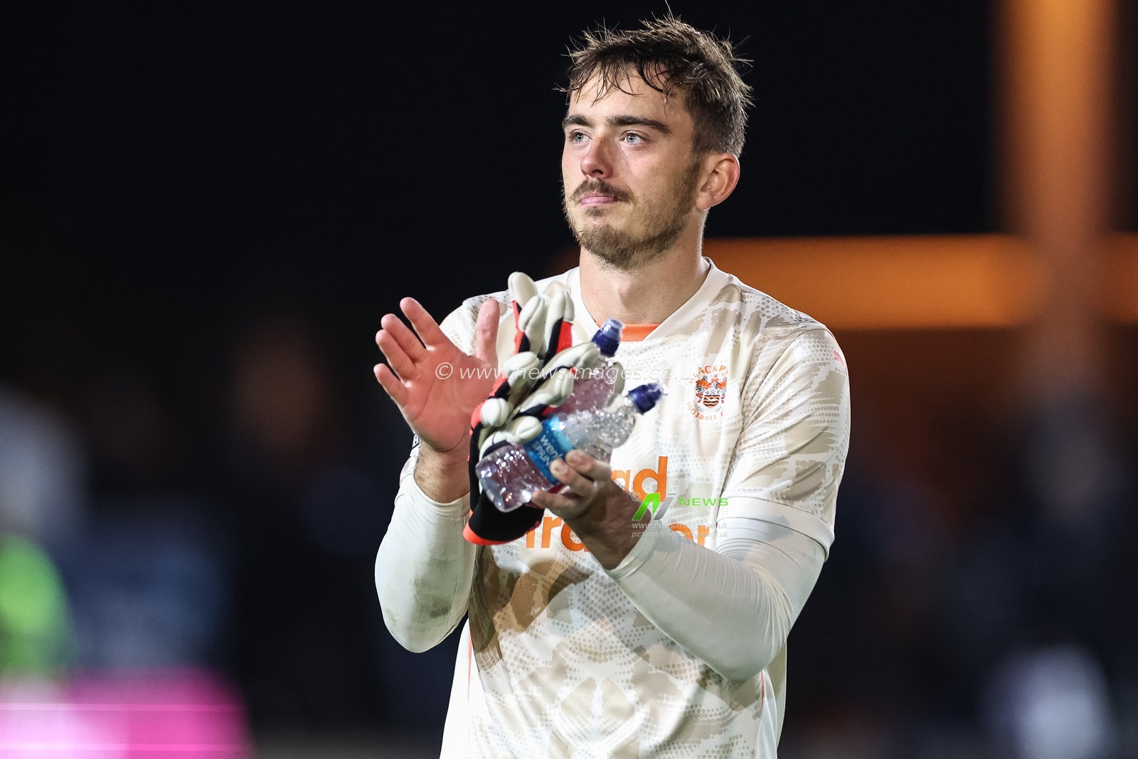 Harry Tyrer of Blackpool applauds the traveling fans during the Sky Bet League 1 match Peterborough United vs Blackpool at Weston Homes Stadium, Peterborough, United Kingdom, 22nd October 2024

(Photo by Mark Cosgrove/News Images)