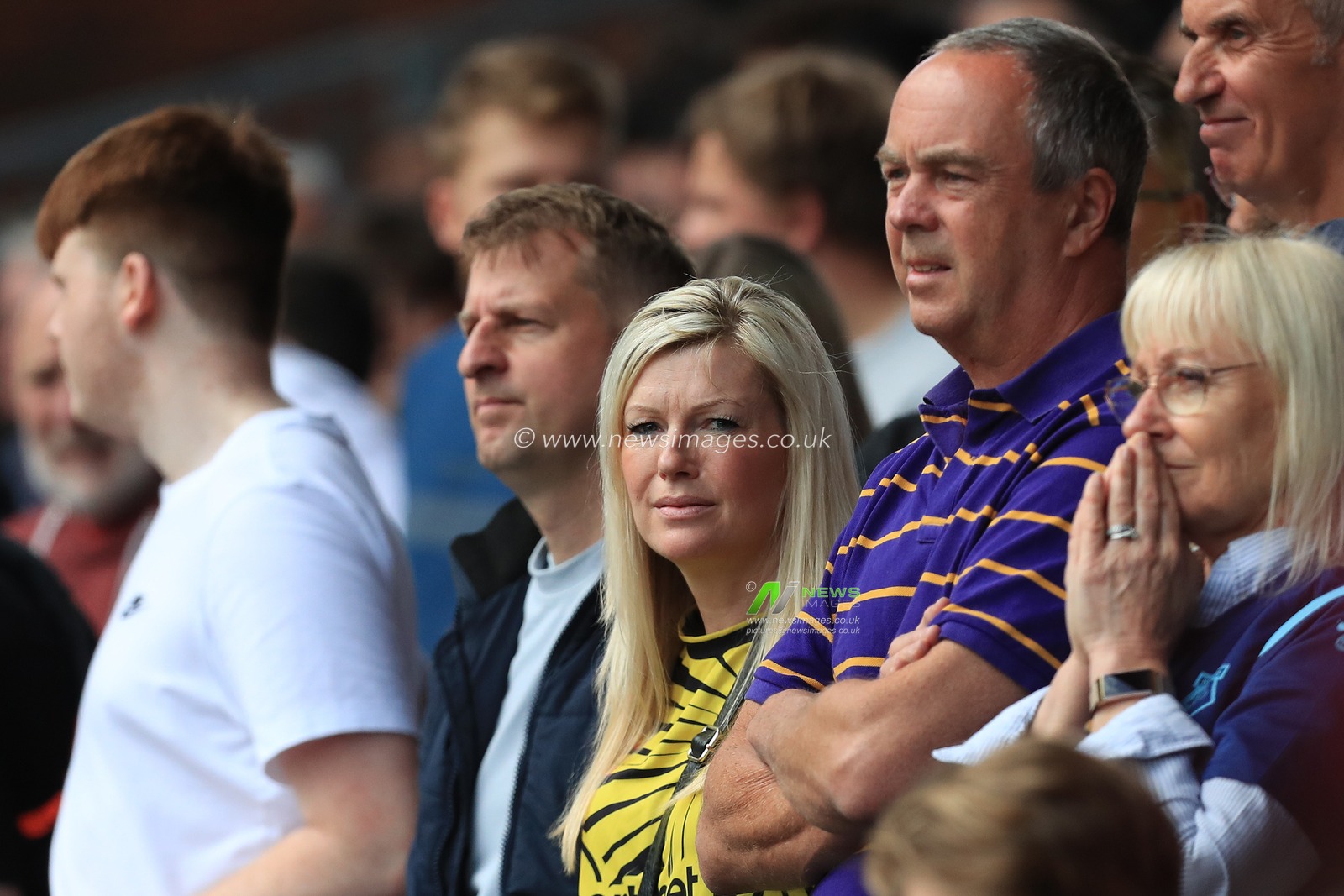 Watford fans watch on anxiously.