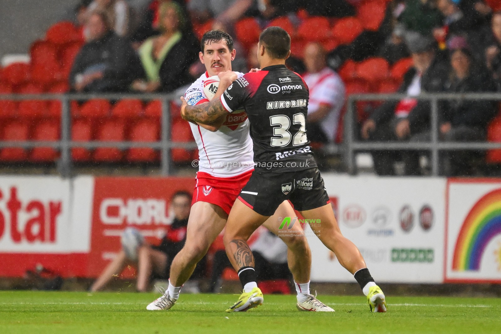 Matt Whitley of St. Helens is tackled by Jayden Nikorima of Salford Red Devils during the Betfred Super League Round 21 match St Helens vs Salford Red Devils at Totally Wicked Stadium, St Helens, United Kingdom, 8th August 2024

(Photo by Craig Thomas/News Images)