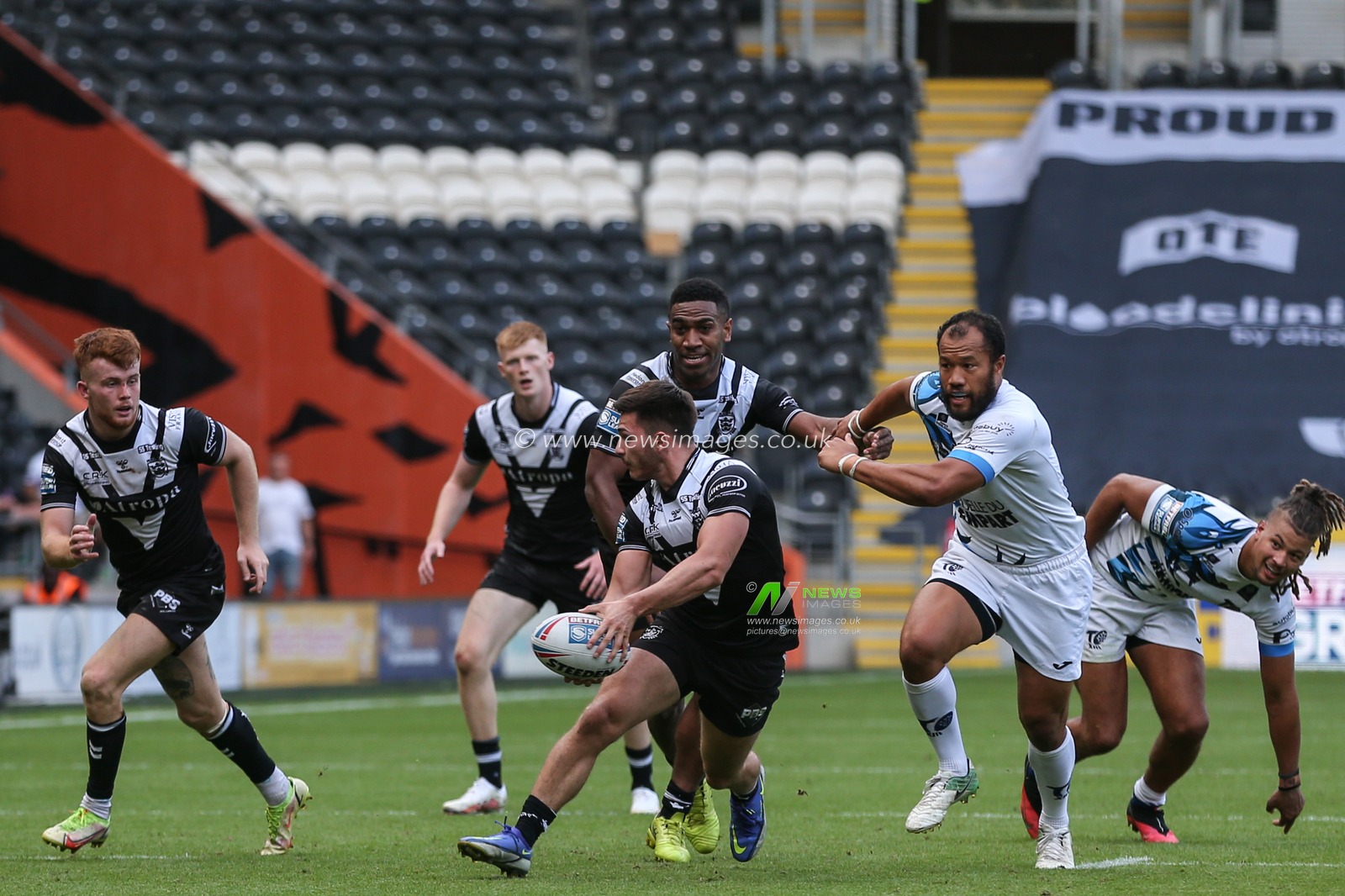 Ben McNamara #19 of Hull FC gets his pass away to Ellis Longstaff #38 of Hull FC