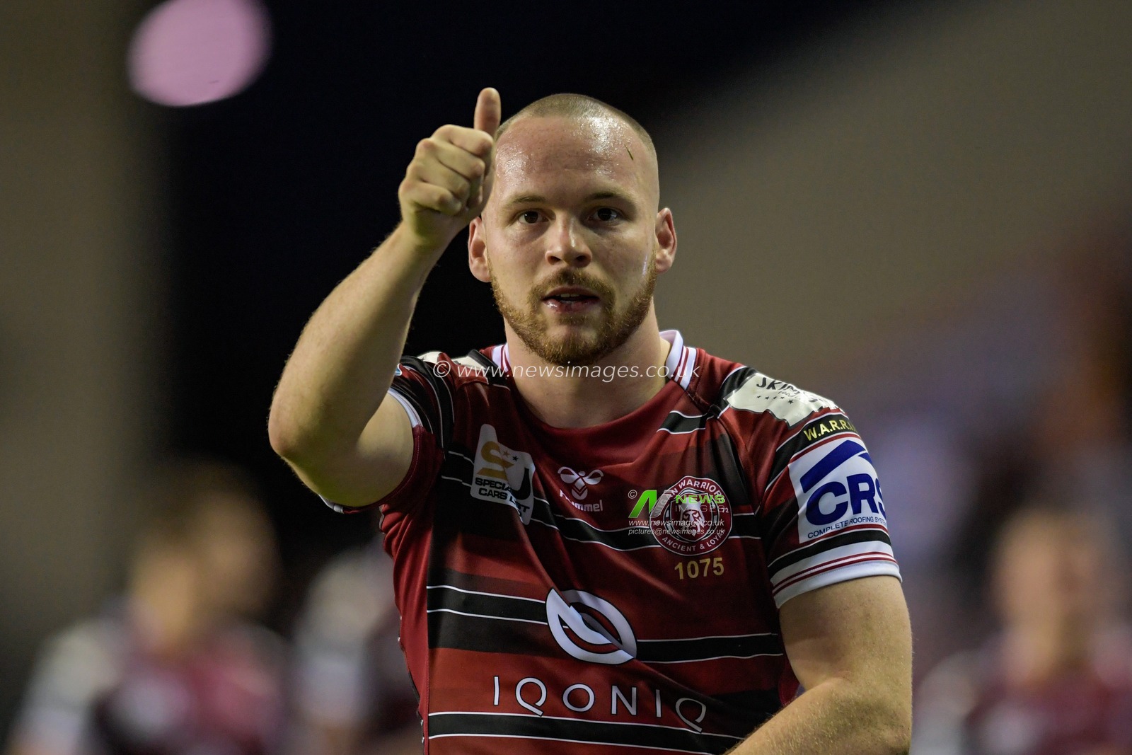 Liam Marshall (5) of Wigan Warriors gives a thumbs up to the crowd after the final whistle