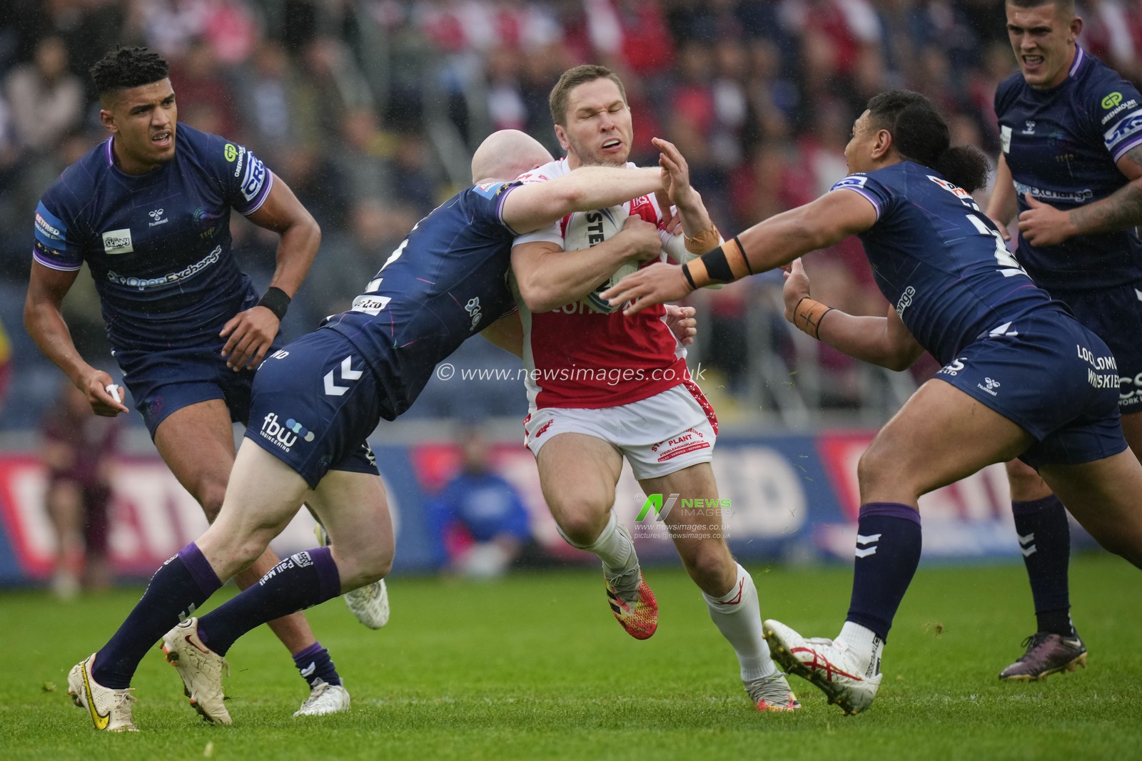 Liam Farrell #12 of Wigan Warriors tackles Matt Parcell #9 of Hull KR during the Betfred Challenge Cup Semi Final match Hull KR vs Wigan Warriors at Sewell Group Craven Park, Kingston upon Hull, United Kingdom, 23rd July 2023

(Photo by Steve Flynn/News Images)