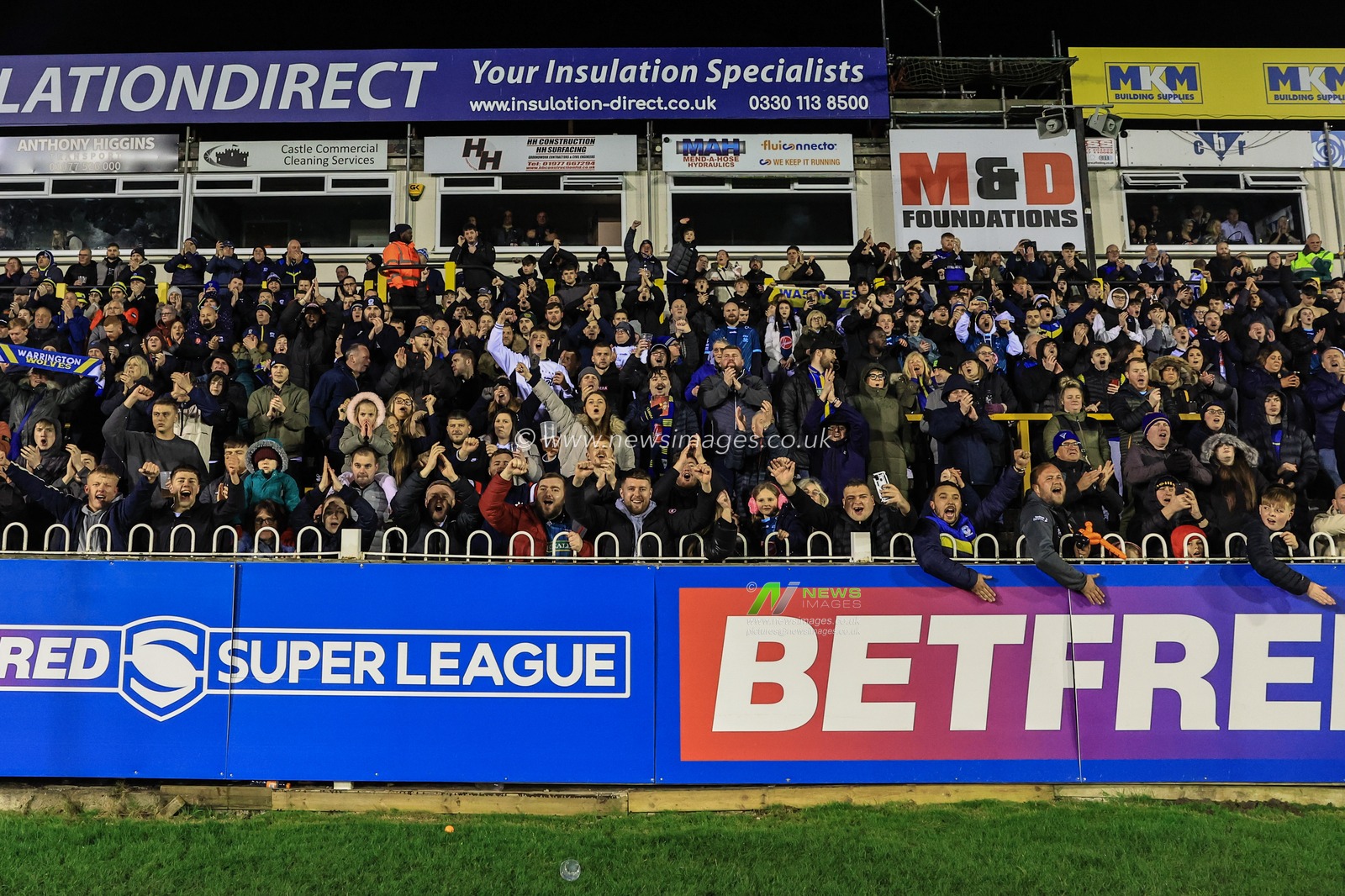 Warrington fans celebrate their sixth straight win as they stay top of the Super League during the Betfred Super League Round 6 match Castleford Tigers vs Warrington Wolves at The Mend-A-Hose Jungle, Castleford, United Kingdom, 24th March 2023

(Photo by Mark Cosgrove/News Images)