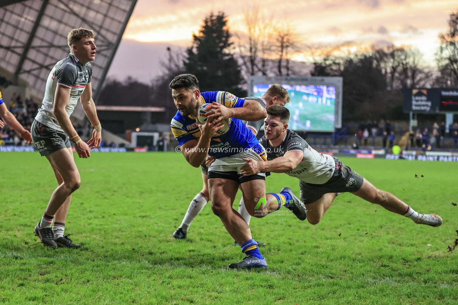 Rhyse Martin of Leeds Rhinos burst through the Hull FC defence to go over for a try