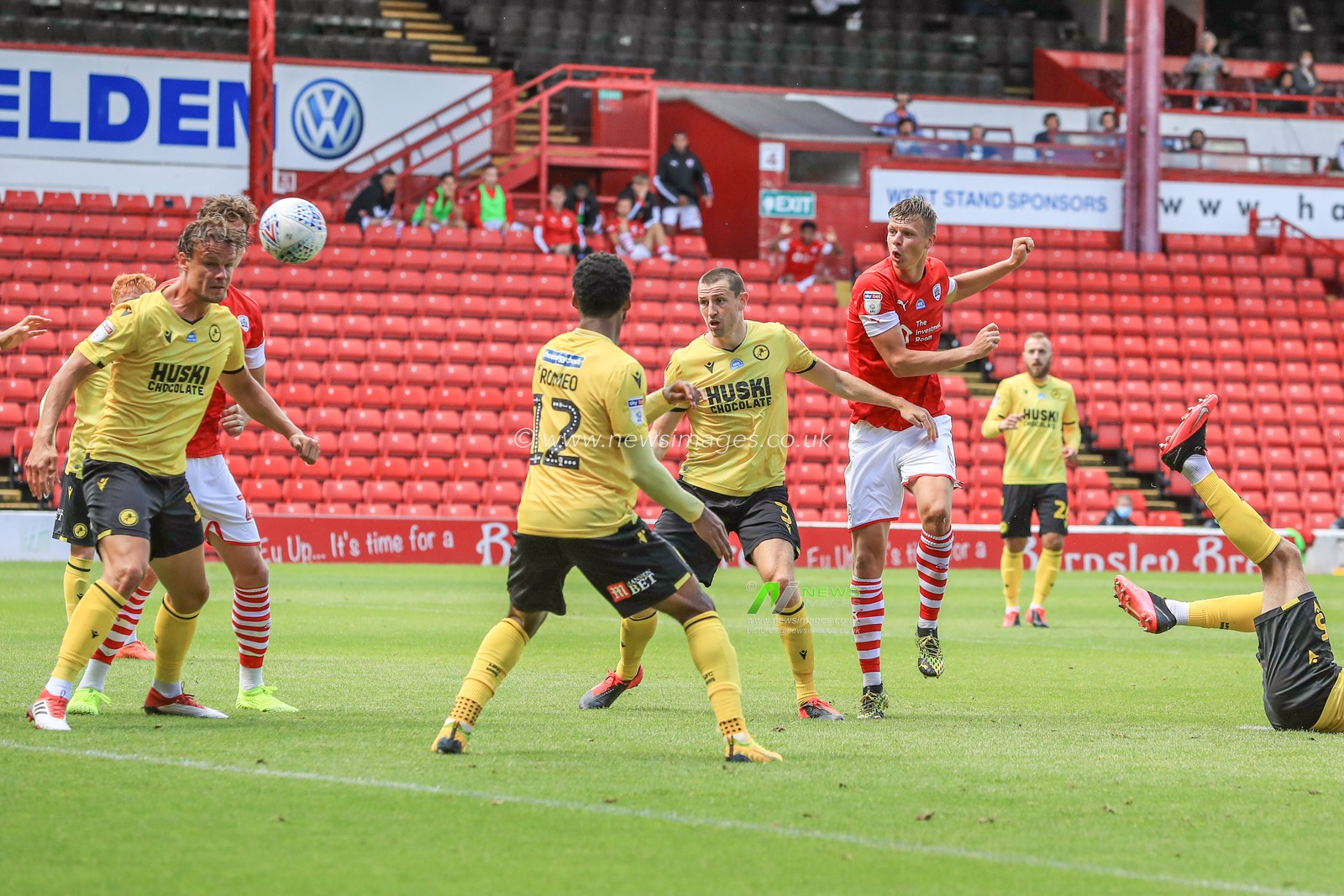 Mads Andersen (6) of Barnsley shoots on goal, Bartosz BiaÅ‚kowski (33) of Millwall saves